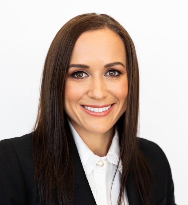 Olivia Hitchens, a leading franchise lawyer, in a professional portrait.